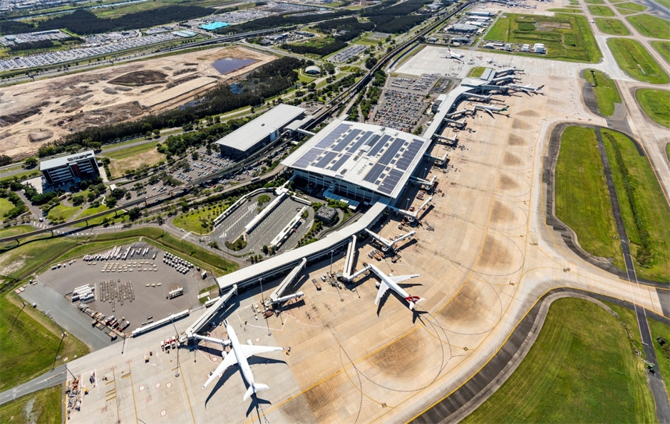 An aerial view of an airport with a 5.73 MW solar array installed on the rooftop.